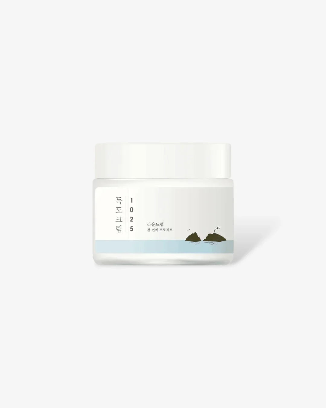 White jar of 1025 Dokdo Cream with Korean text and illustration of rocks and water on label