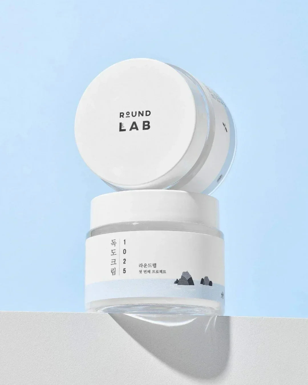 Round Lab Dokdo Cream 1025 skincare jar with minimalist design on white surface