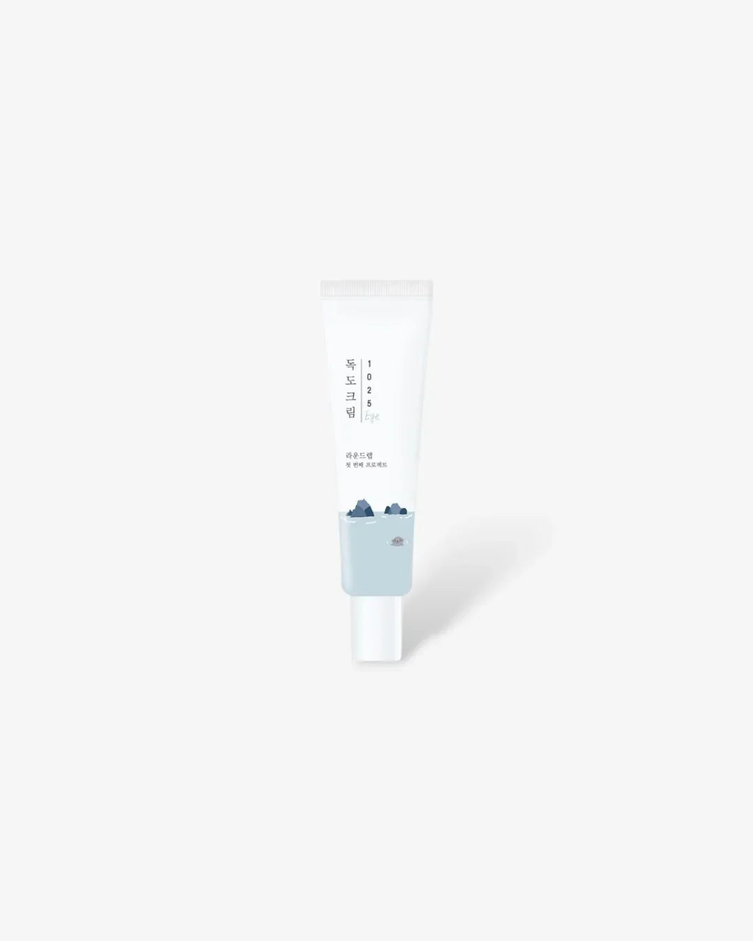 1025 Dokdo Renewal eye cream tube with ocean rock design on white background