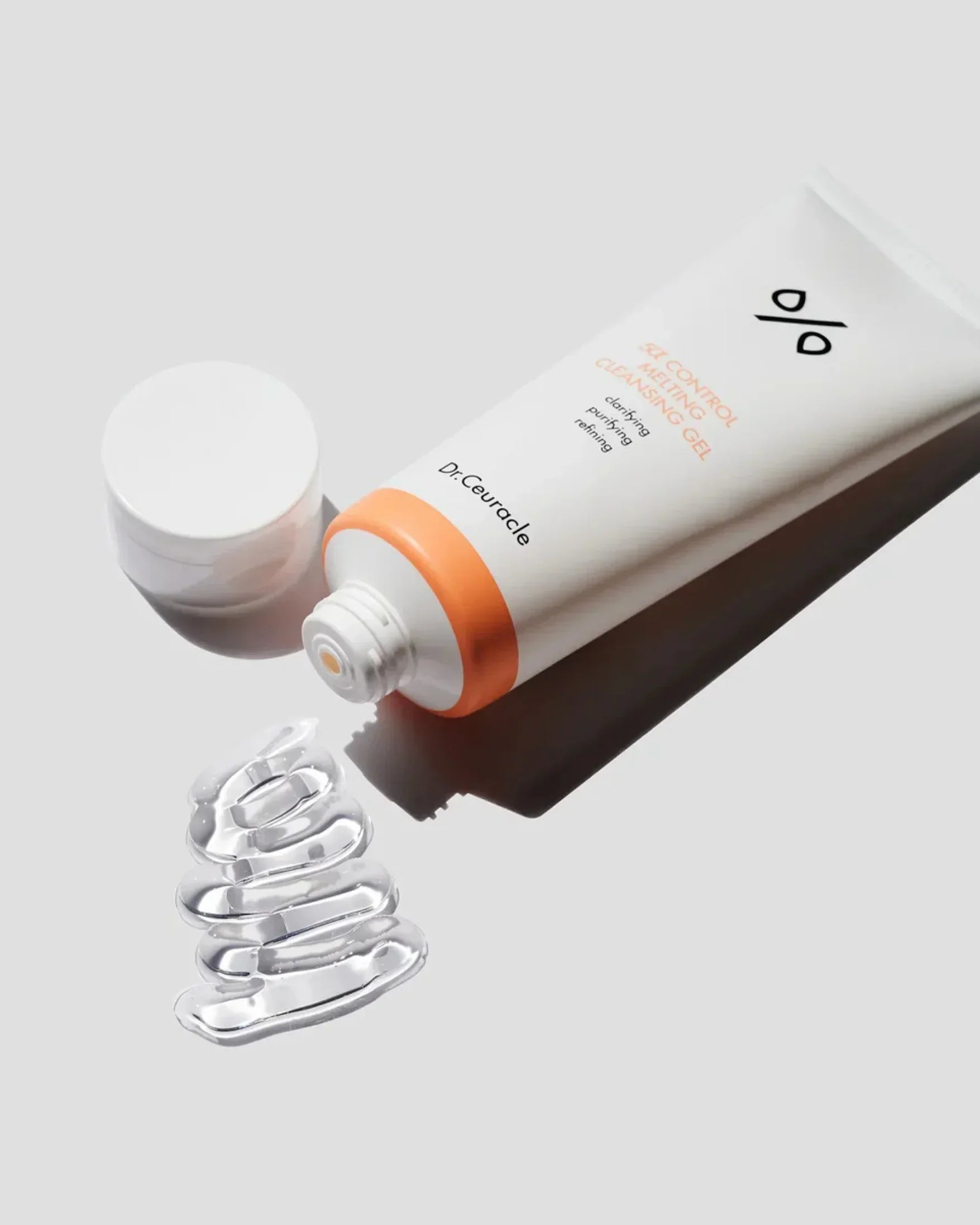 Dr.Ceuracle pH Control Melting Cleansing Gel tube with clear gel spilled on white surface