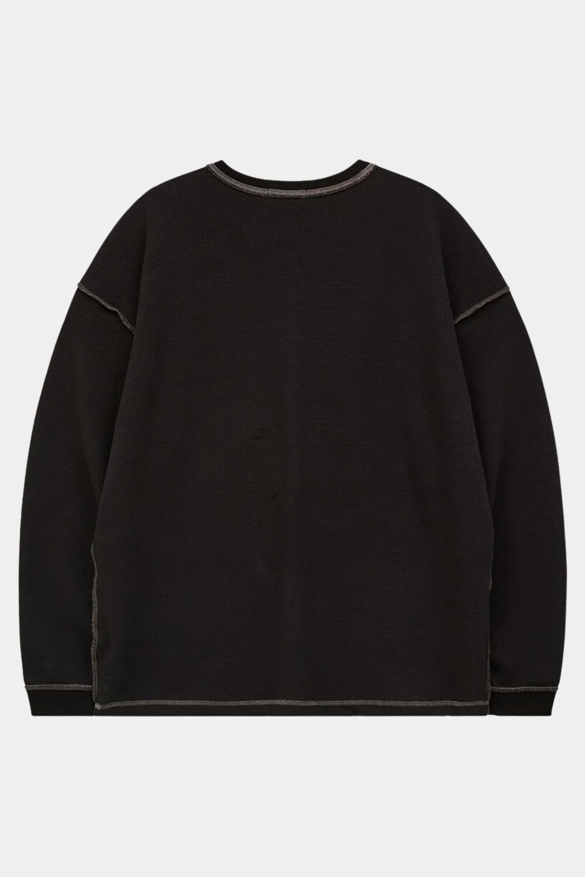 Black waffle long sleeve t-shirt with visible stitching on seams and cuffs, back view