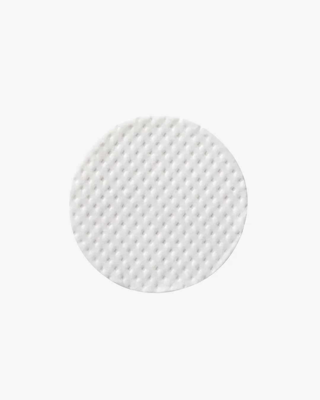 Close-up of a round white textured pore peptide pad on a plain white background