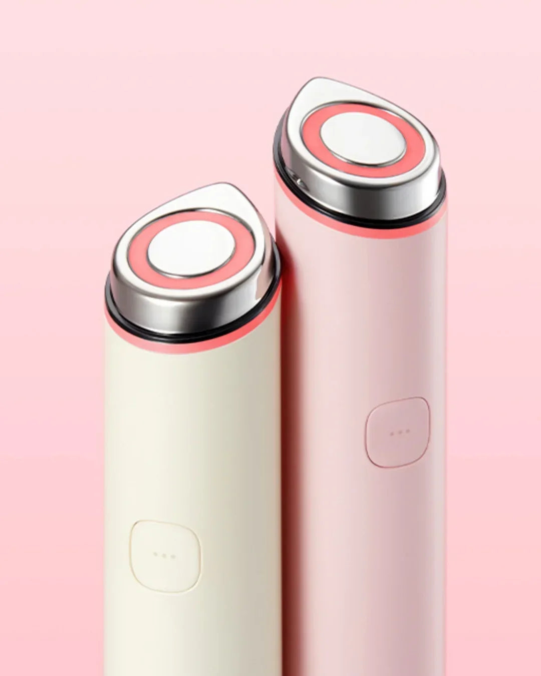 Two pastel Korean beauty skincare devices with metallic tips on a pink background, Malkn UK