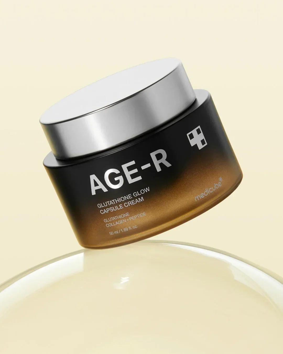 AGE-R Glutathione Glow Capsule Cream by Medicube in brown jar with silver lid on beige background