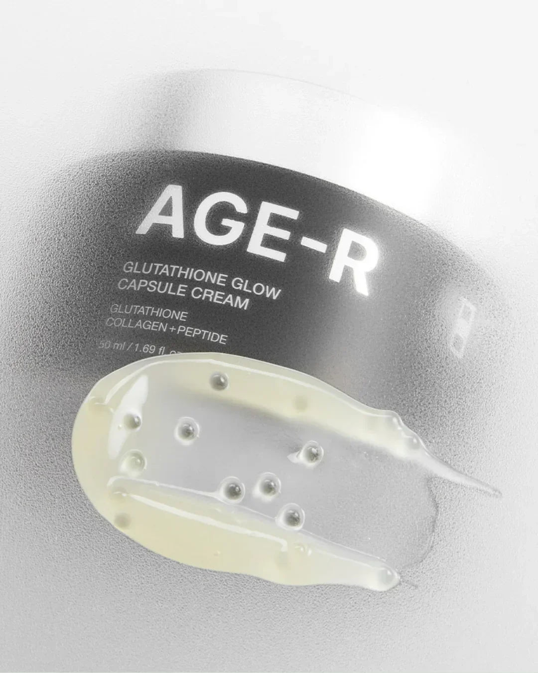 AGE-R Glutathione Glow Capsule Cream jar with clear gel swatch showing texture