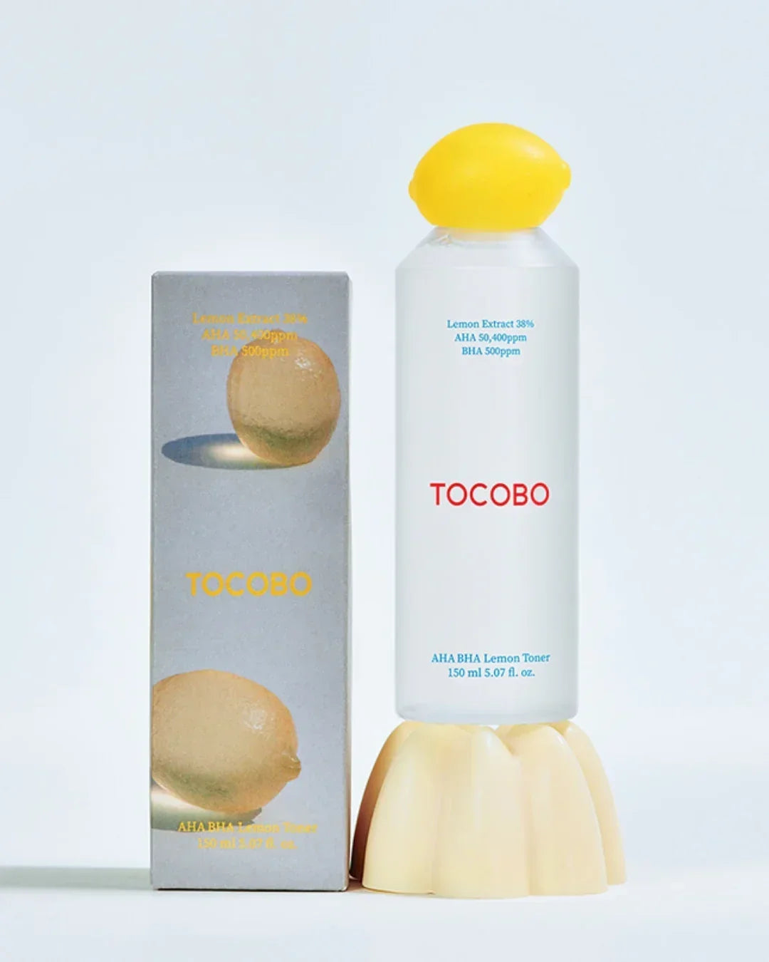 TOCOBO AHA BHA Lemon Toner 150ml with lemon cap, displayed with lemon-themed gray packaging box