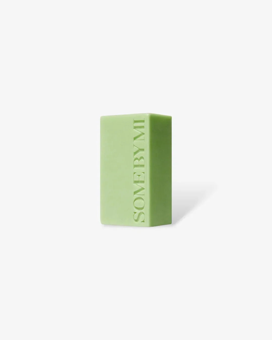 Green rectangular cleansing bar with SOMEBYMI embossed on side, on white background
