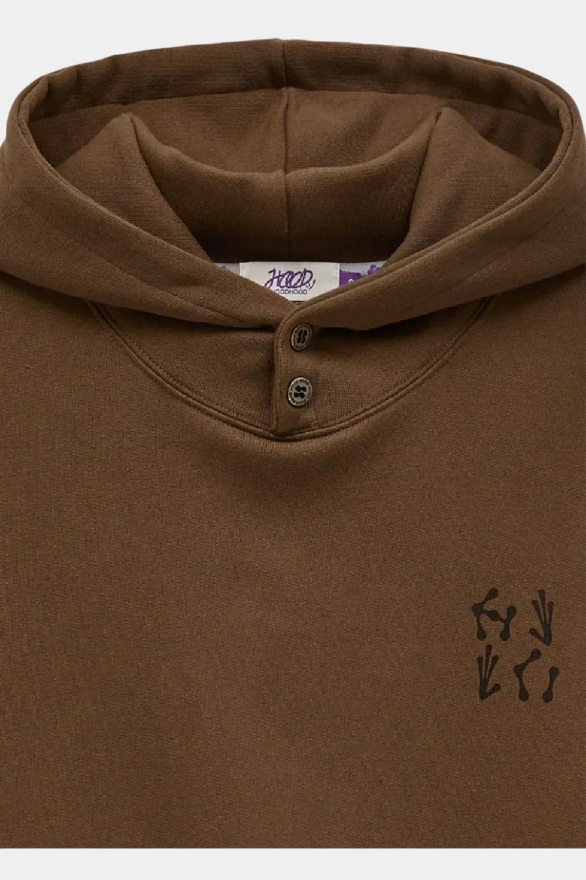 Brown hoodie with buttons on neckline and small black abstract print on chest