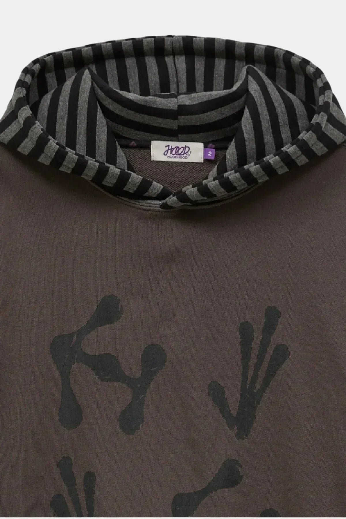 Charcoal hoodie with black abstract alien hands print and black-and-gray striped hood lining