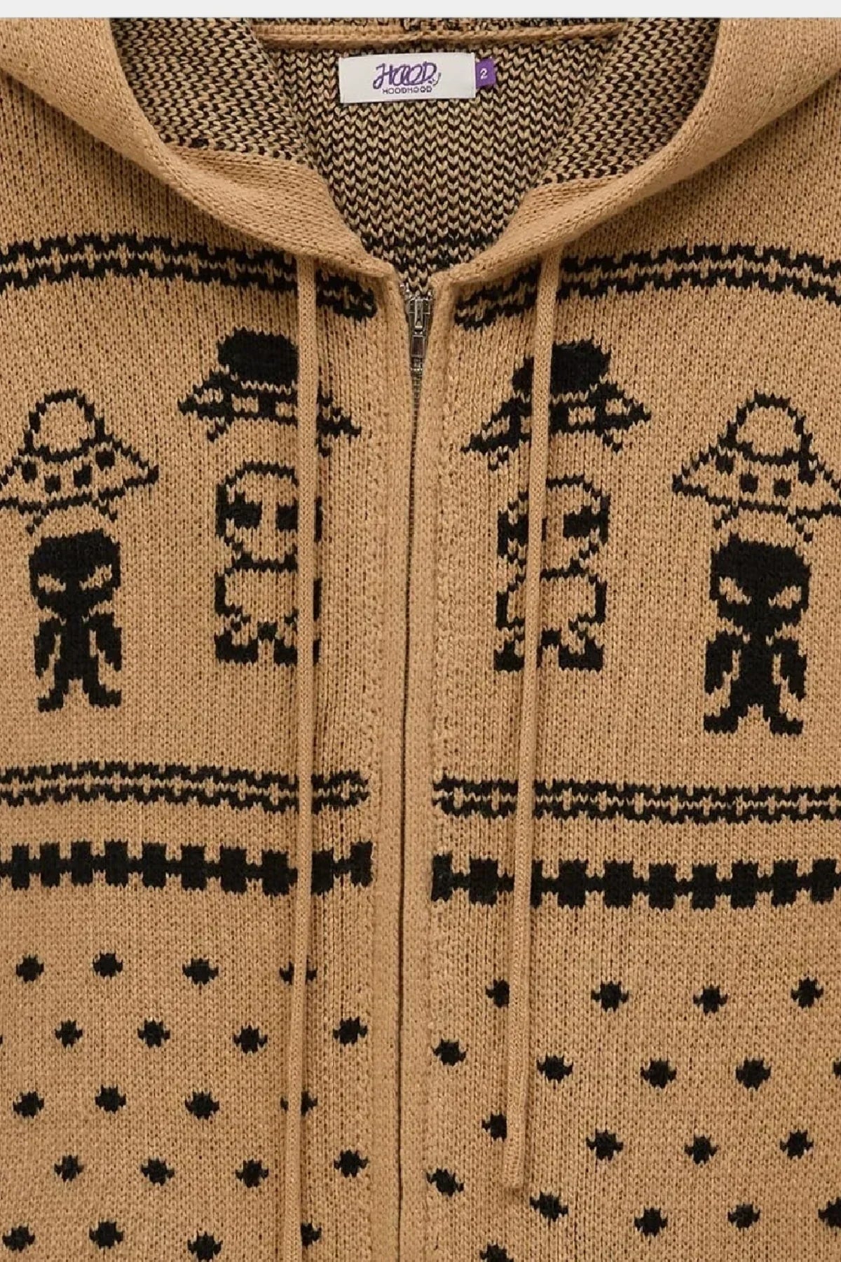 Beige knit zip-up hoodie with black alien and UFO pattern and drawstrings on hood