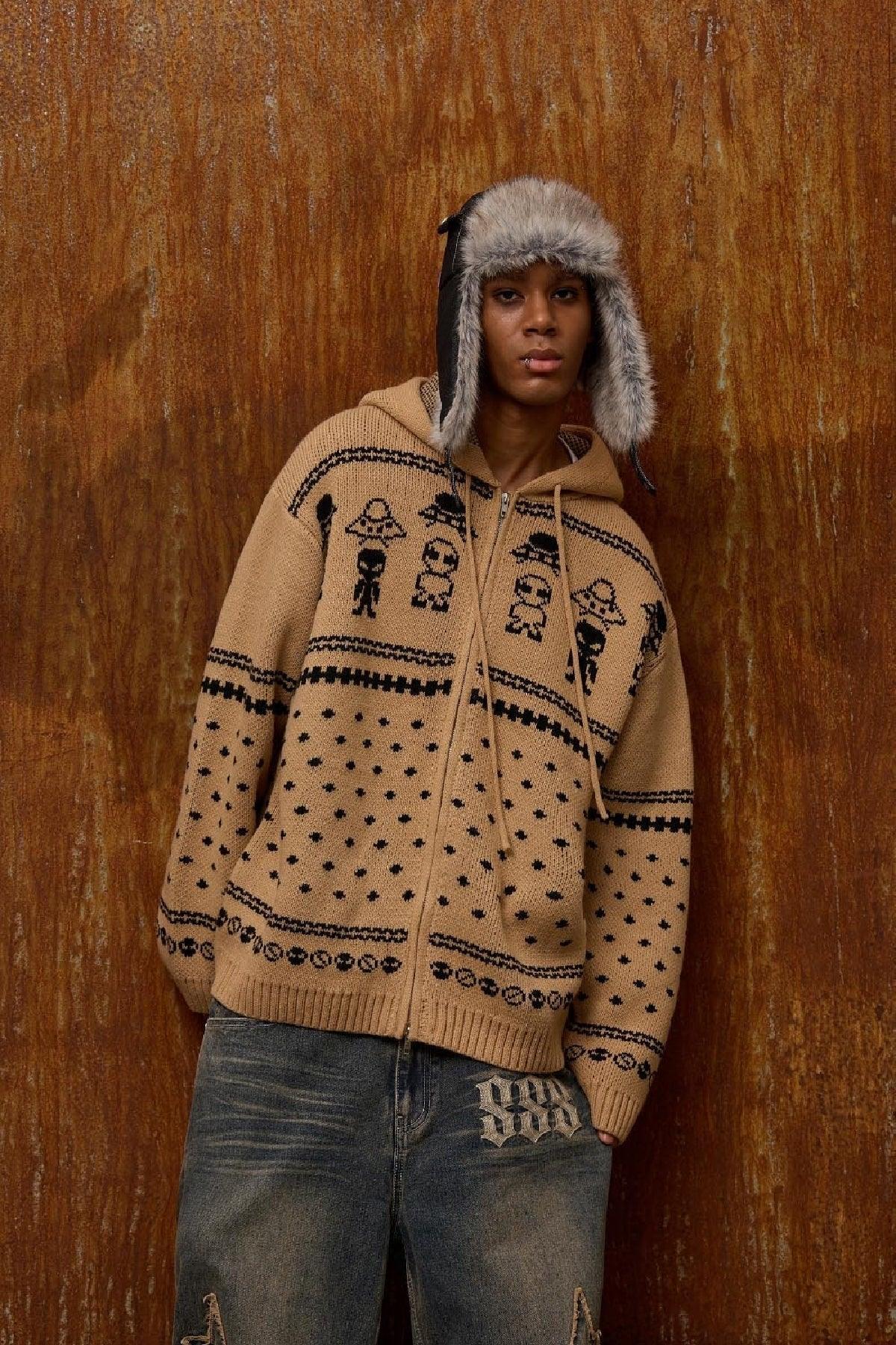 Model wearing beige alien pattern knit zip-up hoodie and gray jeans with vintage background