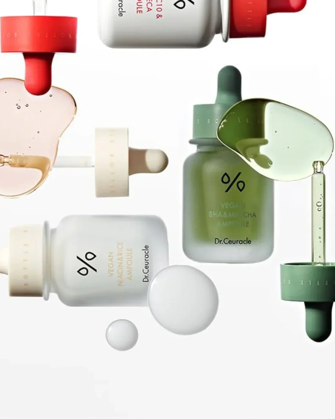 Dr.Ceuracle vegan niacinamide and matcha ampoule bottles with dropper and serum drops on white background