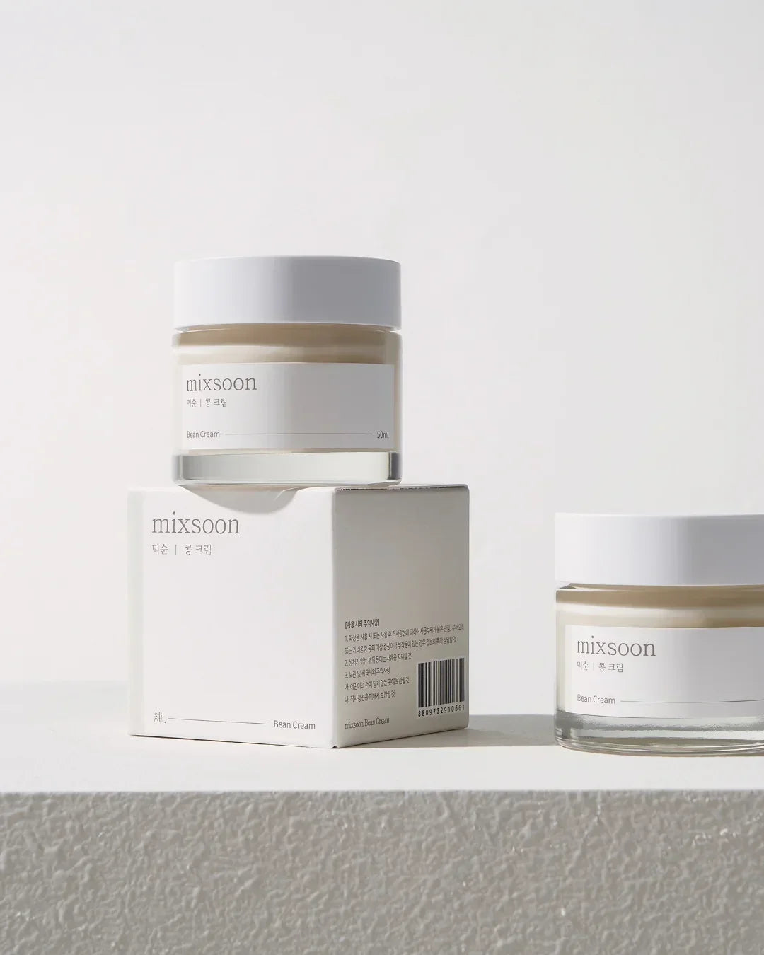 Mixsoon Bean Cream 50ml jar with white lid and minimalist packaging on textured white surface