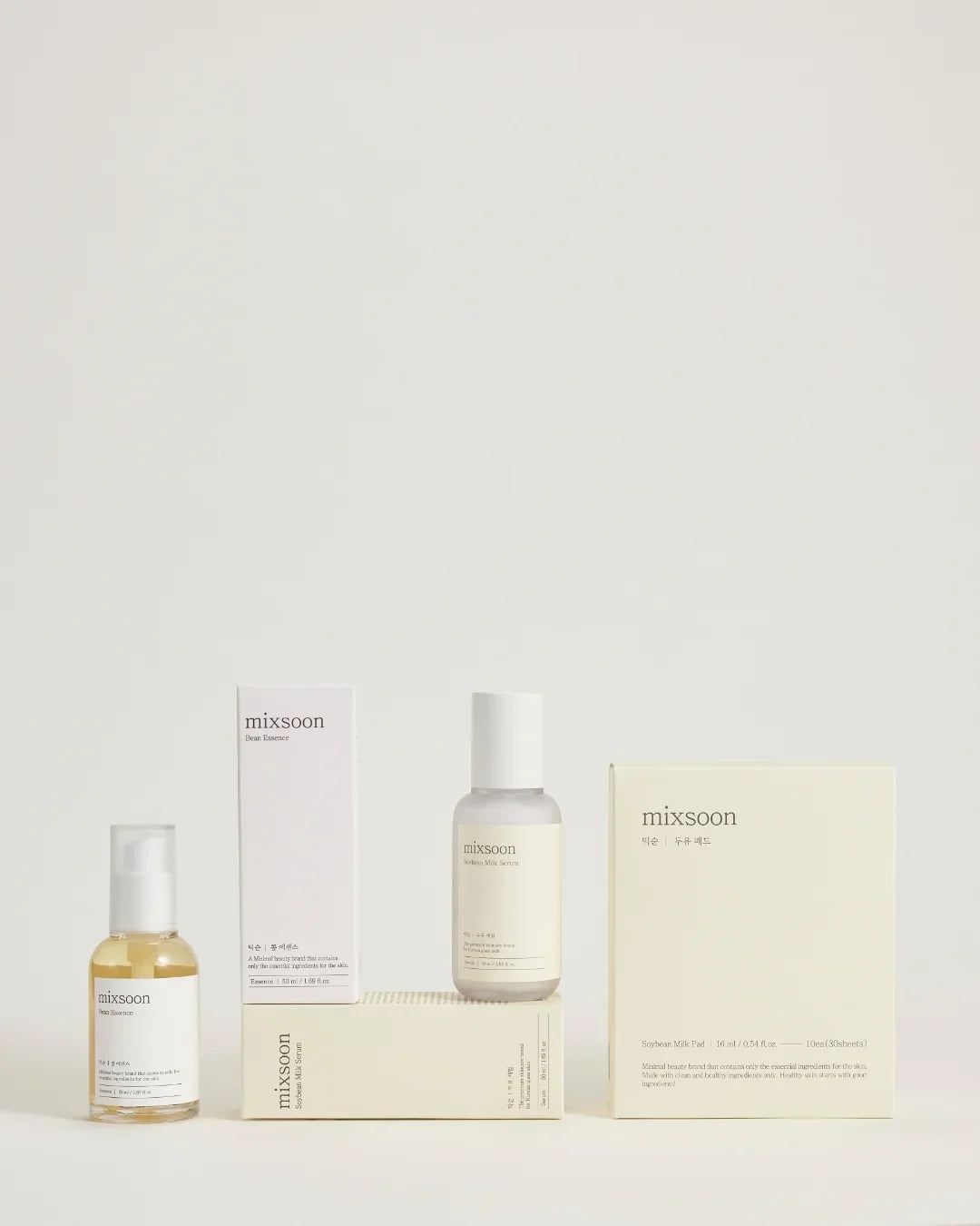 Mixsoon Bean Essence and Soybean Milk Serum skincare products with minimalist white and cream packaging