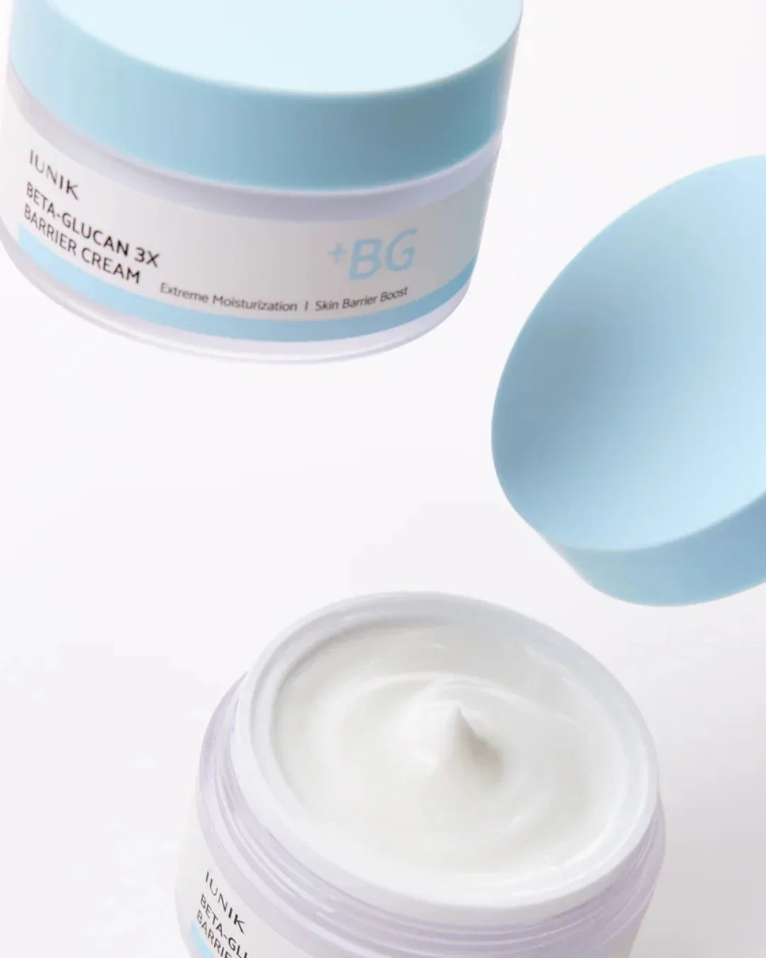 IUNIK Beta-Glucan 3x Barrier Cream jars with light blue lids, showing creamy white moisturizer inside