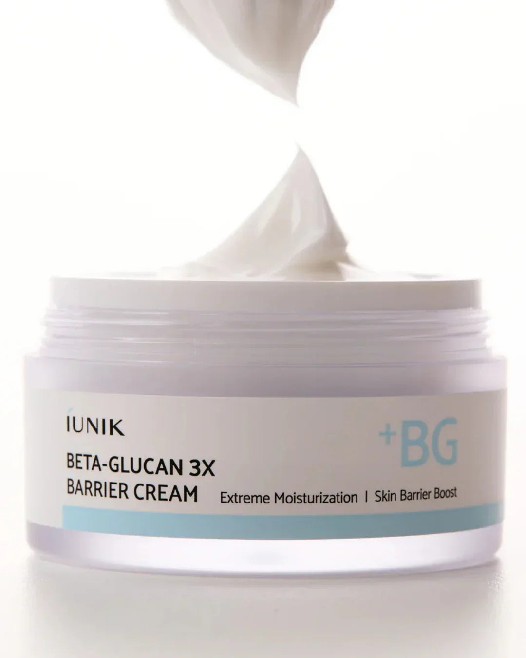 iUNIK Beta-Glucan 3X Barrier Cream jar with creamy moisturizer on spoon, skincare product