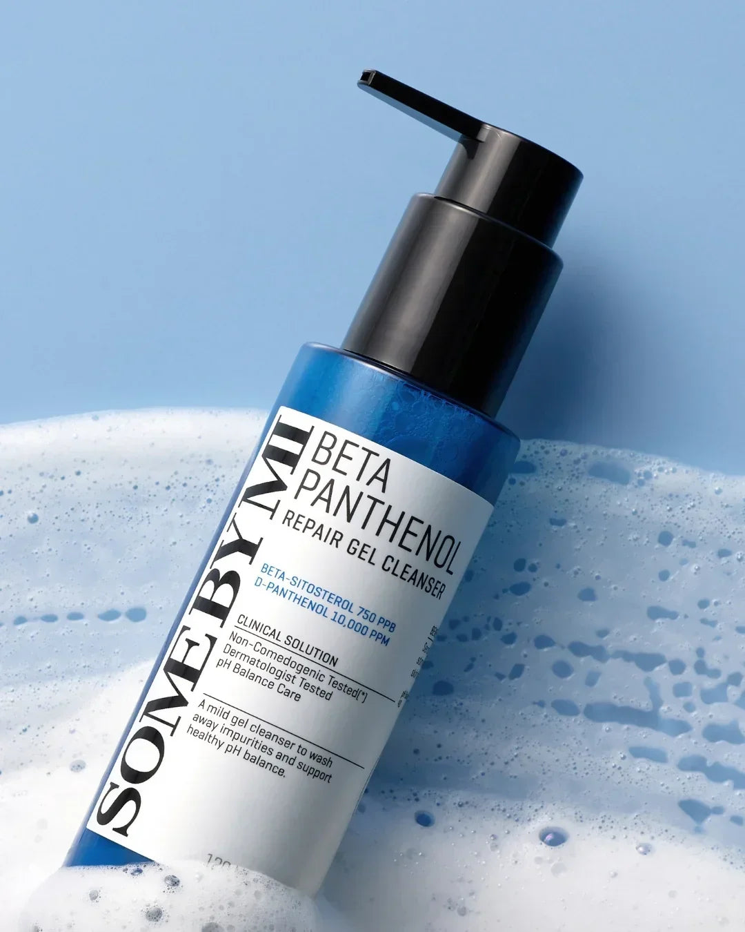 SOMEBYMI Beta Panthenol Repair Gel Cleanser bottle with foam on blue background