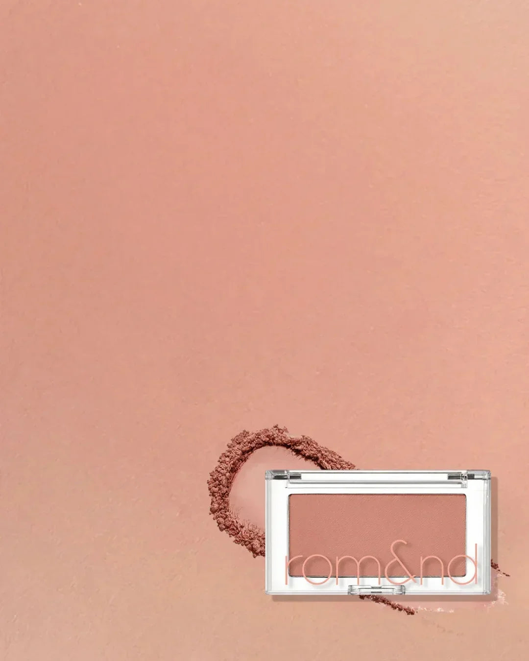 Rom&nd Better Than Cheek blush in Fig Chip shade with powder swatch on peach background