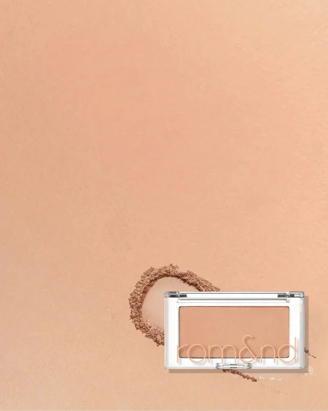 Rom&nd Better Than Cheek blush in Pear Chip shade with soft peachy pink background