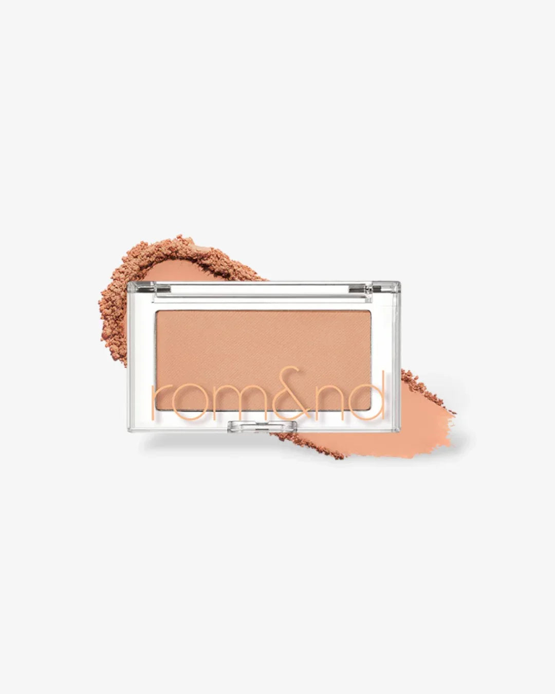 Rom&nd pressed powder blush in pear chip shade with loose powder and smear on white background