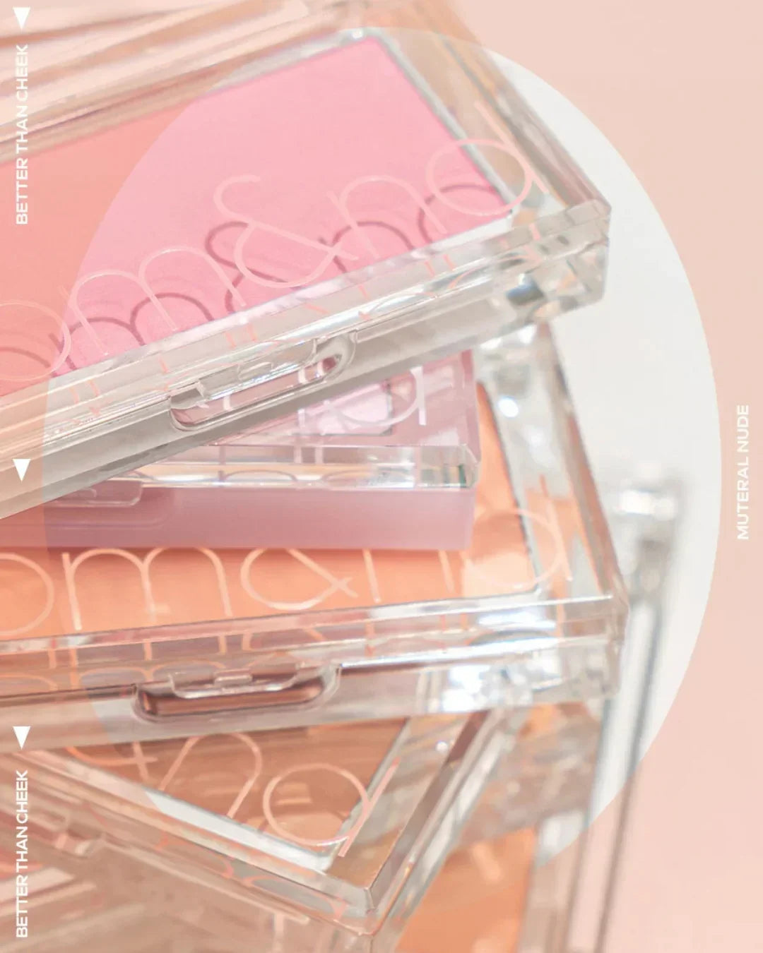 Stack of clear plastic makeup compacts featuring blush and nude shades, labeled Better Than Cheek