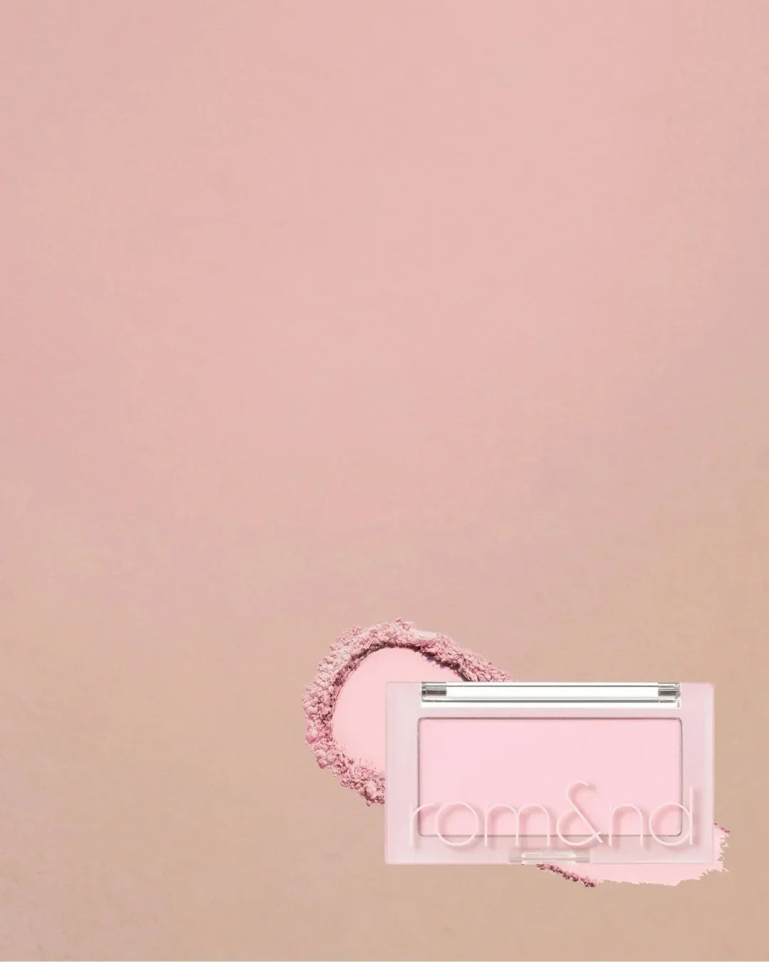 Rom&nd soft pink powder blush compact on matching pink background