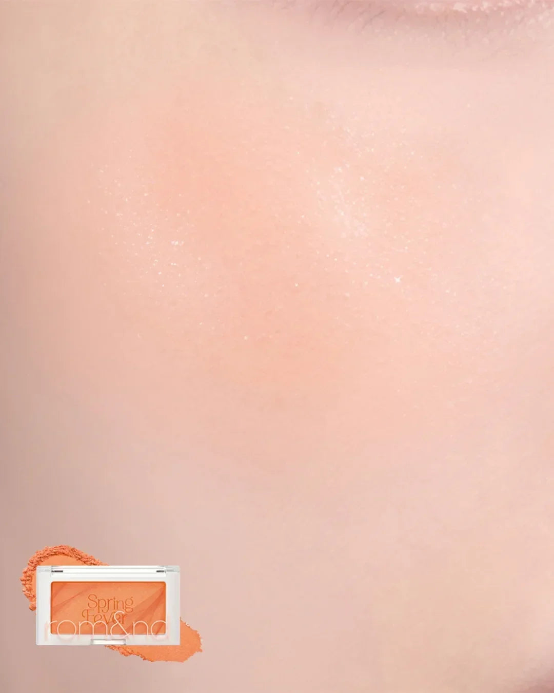 Close-up texture of mango chip orange blush makeup with compact powder on peach background
