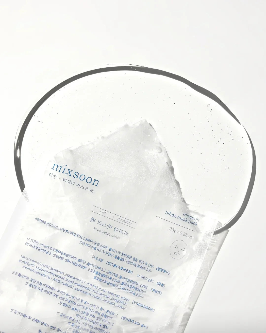 Mixsoon bifida mask pack packet partially submerged in clear gel on white background