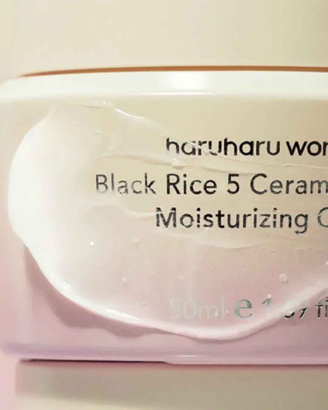 Close-up of Haruharu Black Rice 5 Ceramide Moisturizing Cream texture on container