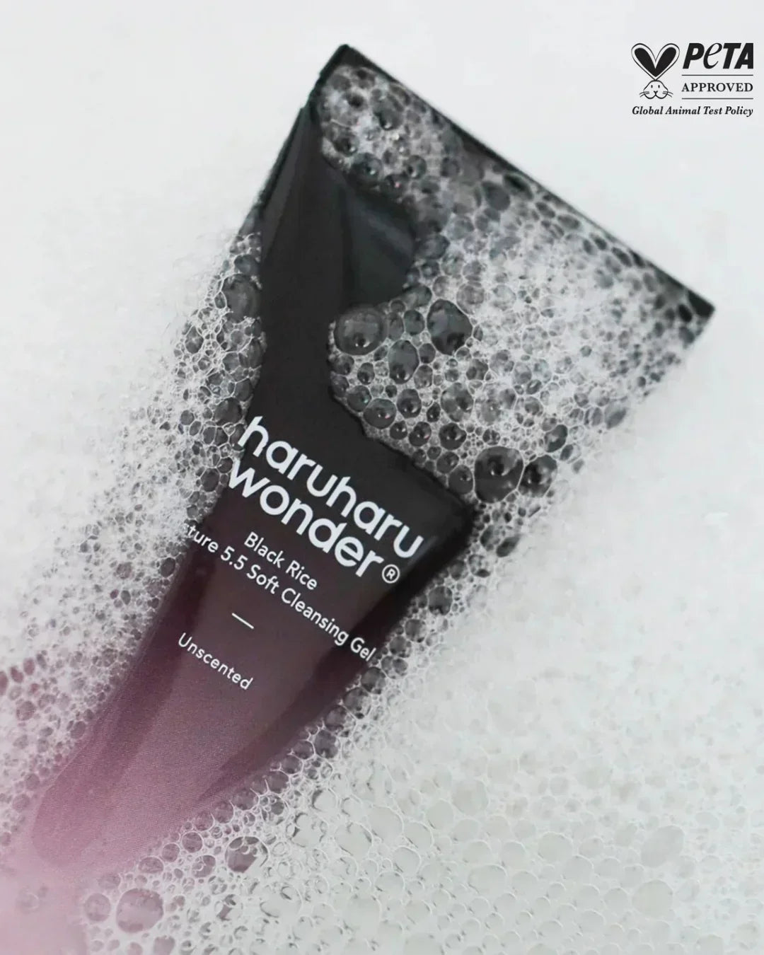 haruharu wonder Black Rice Soft Cleansing Gel tube covered in foam bubbles, PETA approved