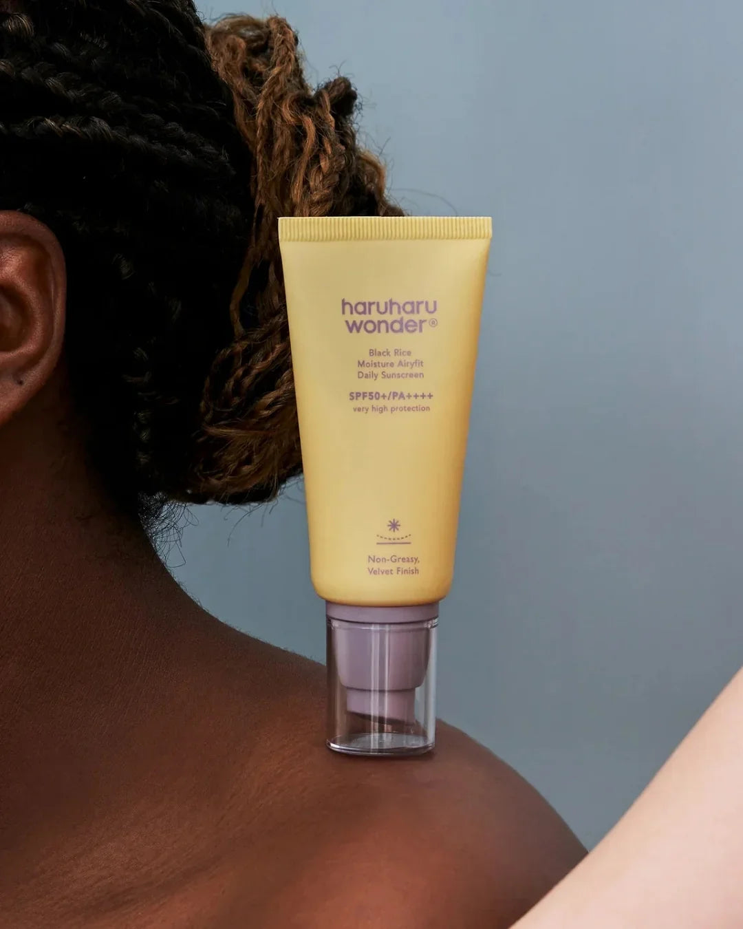 Haruharu Wonder Black Rice Moisture Airyfit Daily Sunscreen on shoulder, Korean skincare