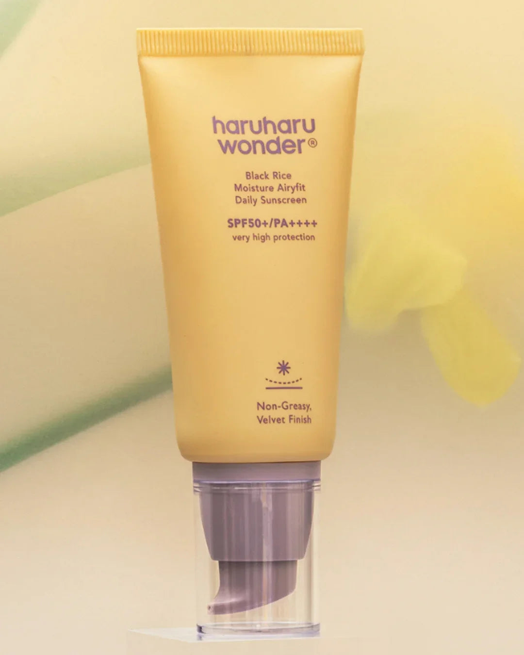 Haruharu Wonder Black Rice Moisture Airyfit Daily Sunscreen SPF50 tube on neutral background, Korean beauty product from Malkn UK lifestyle platform