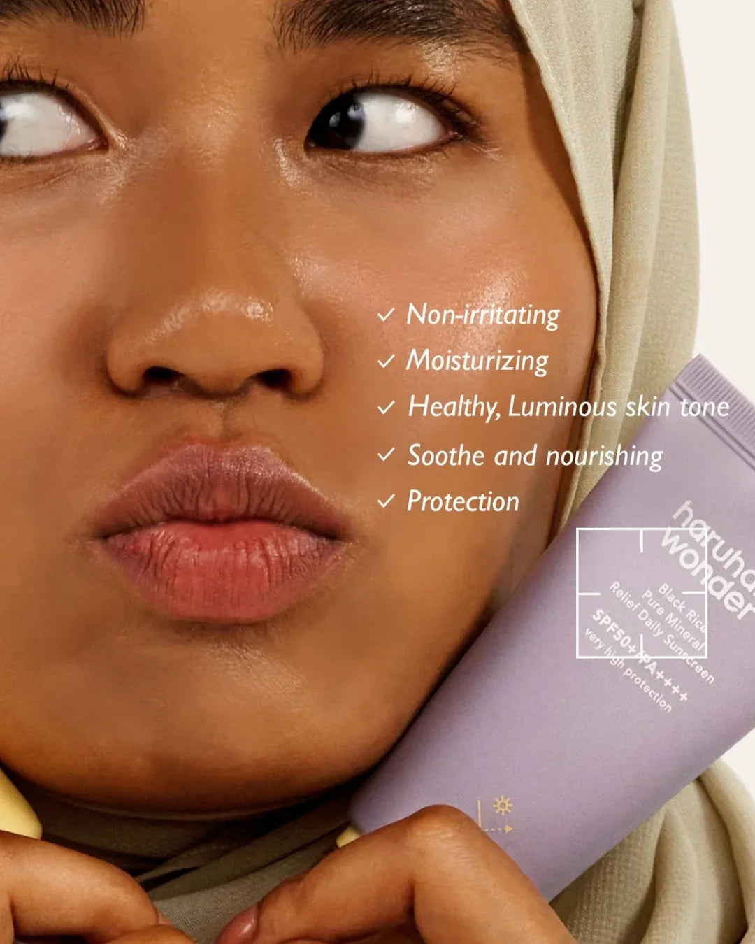 Model holding Haruharu Wonder Black Rice Pure Mineral Relief Daily Sunscreen SPF50 PA++++, with benefits listed, for Korean beauty at Malkn.