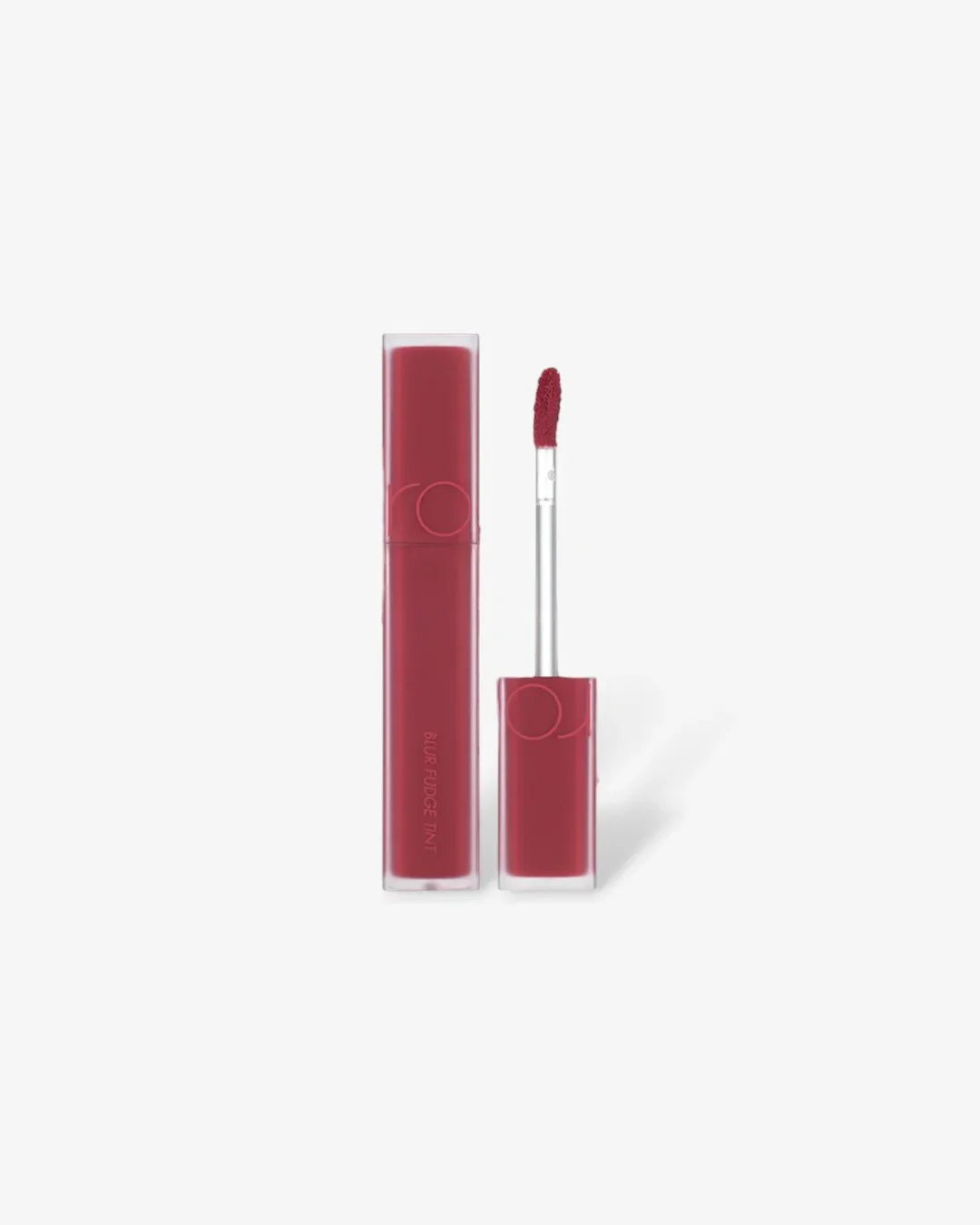 Red liquid lip tint with applicator wand on white background, labeled Blur Fudge Tint
