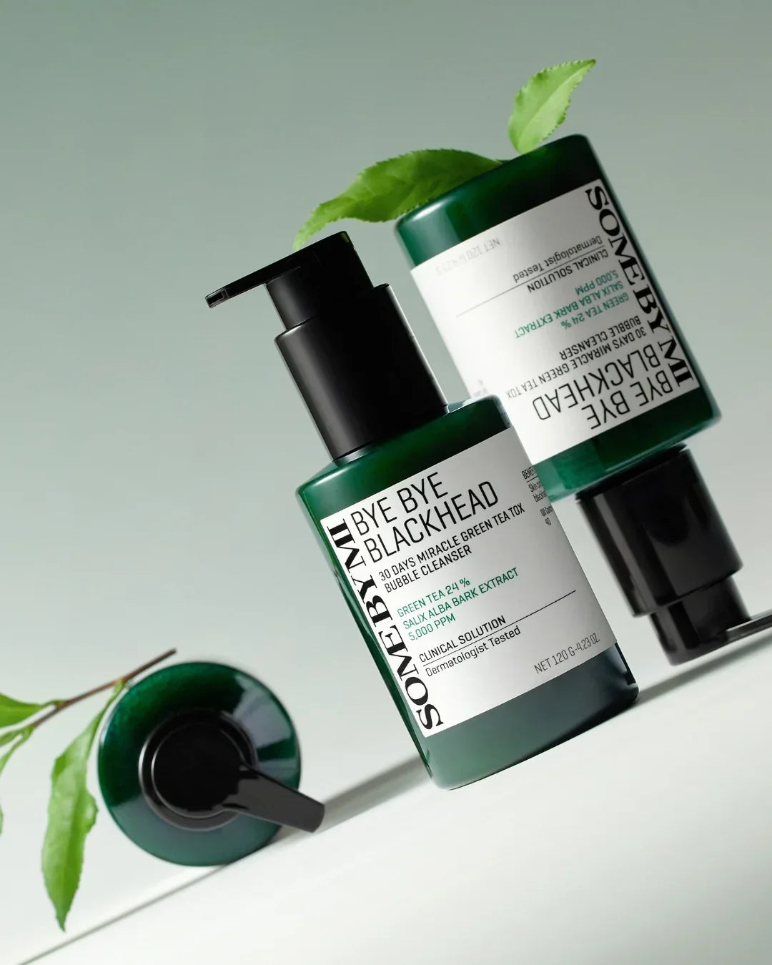 Some By Mi Bye Bye Blackhead 30 Days Miracle Green Tea Tox Bubble Cleanser bottles with green leaves