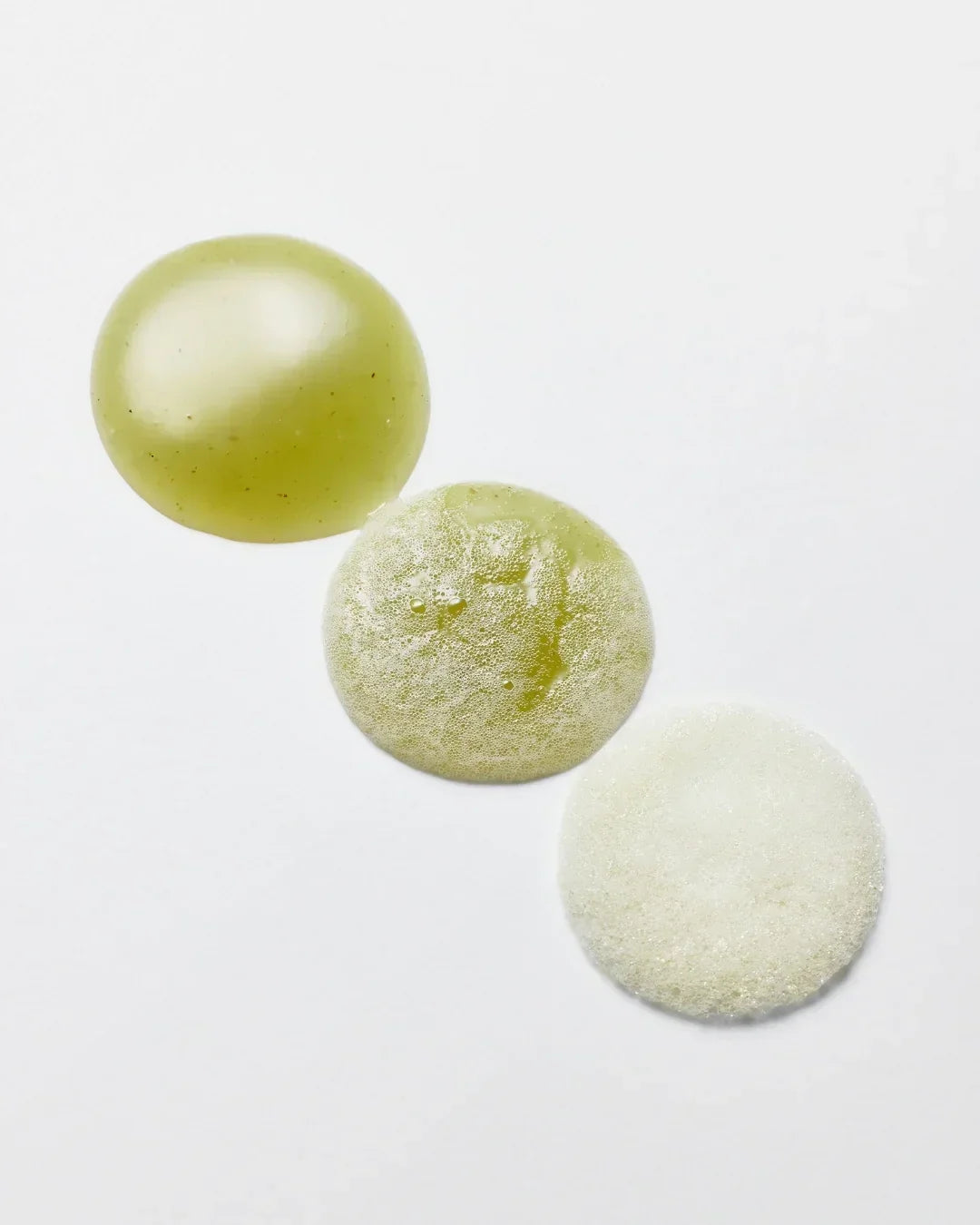 Three green tea cleanser texture samples on white background showing gel, foamy, and bubbly forms