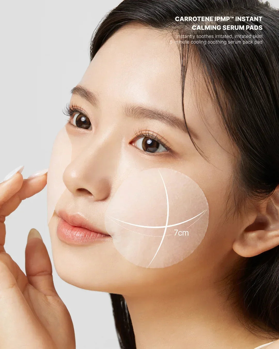 Close-up of woman applying 7cm Carotene IPMP Instant Calming Serum Pads on cheeks for soothing skin