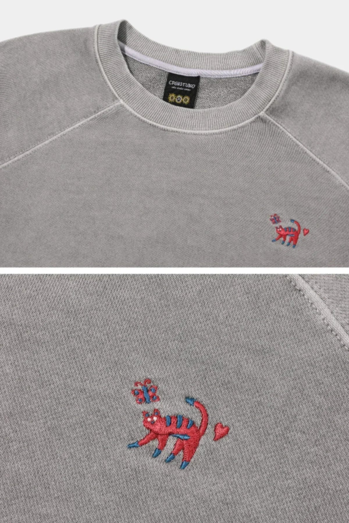 Ghost gray raglan sweatshirt with red and blue embroidered cat and butterfly detail
