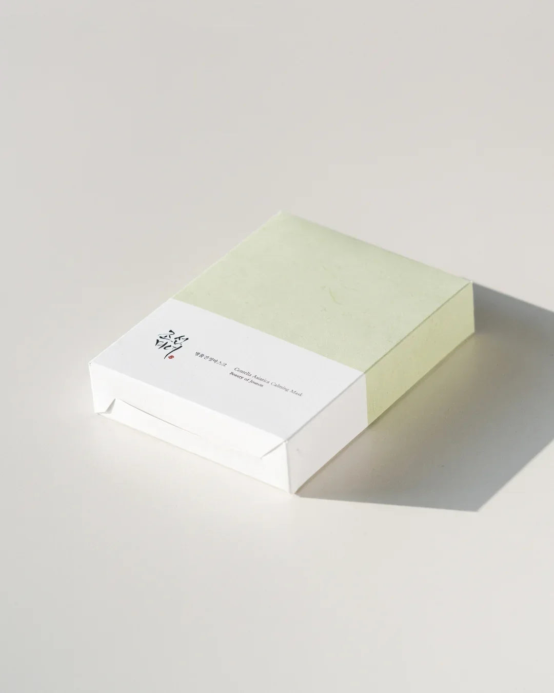 Centella Asiatica Calming Mask 10-pack in green and white minimal packaging on white surface