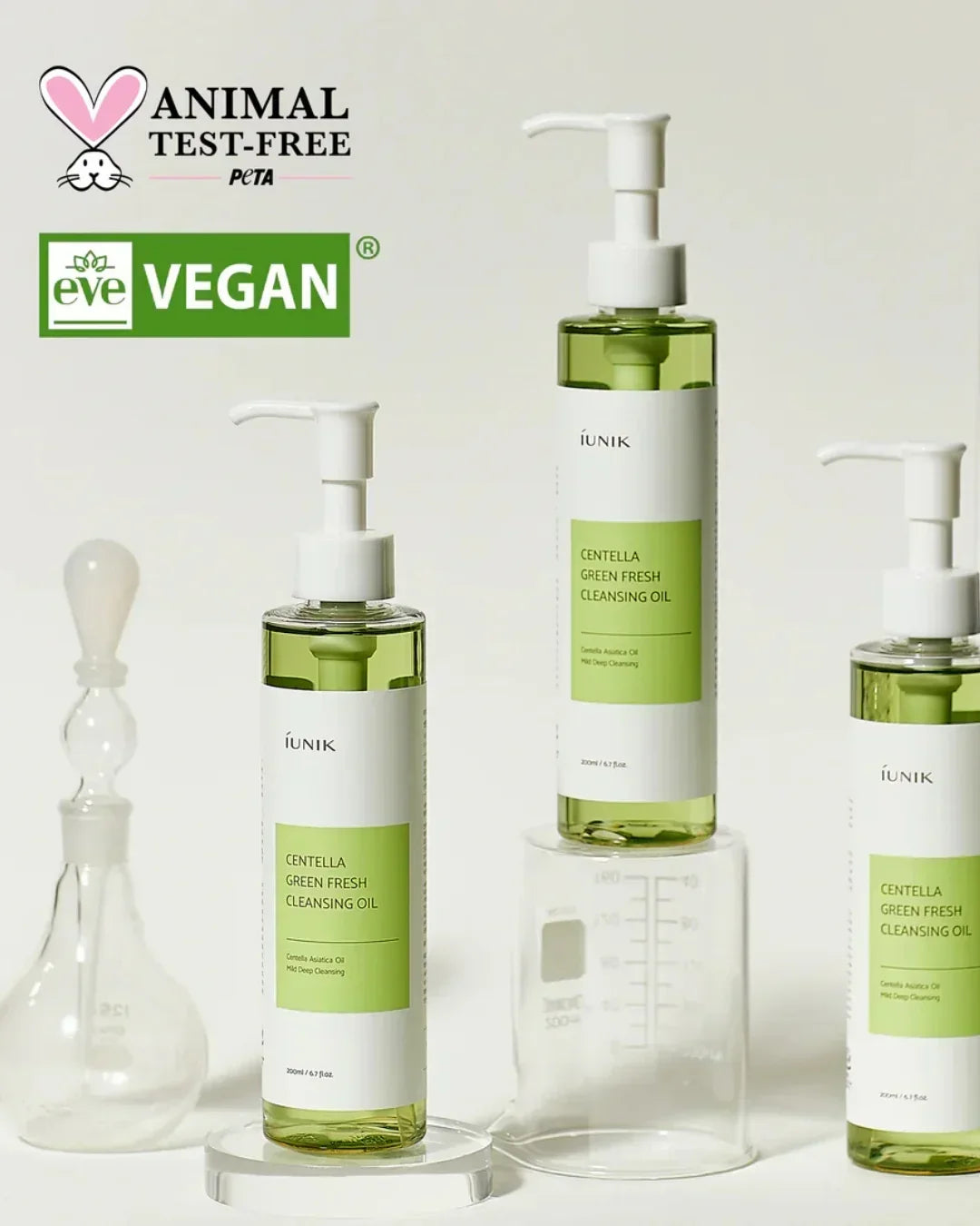 iUNIK Centella Green Fresh Cleansing Oil bottles with lab glassware and animal test-free vegan certification logos