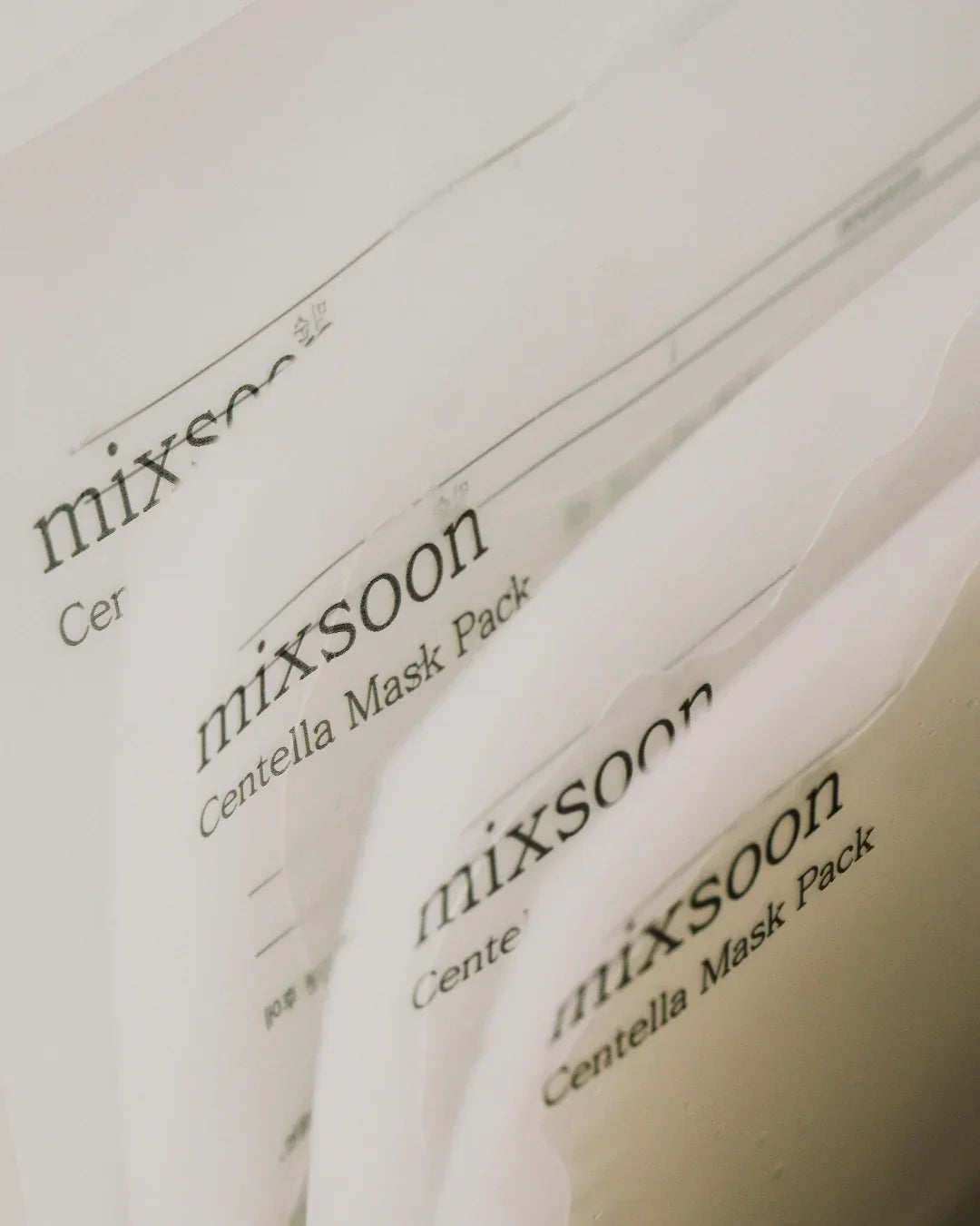 Close-up of Mixsoon Centella Mask Pack skincare sheet masks in minimal white packaging