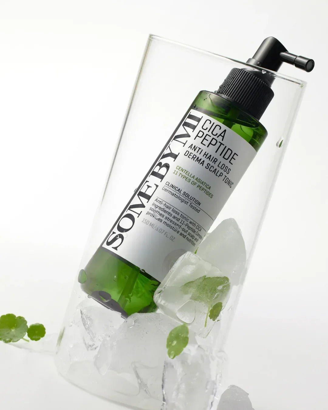 Somebymi Cica Peptide Anti Hair Loss Derma Scalp Tonic bottle in clear glass with ice cubes and green leaves