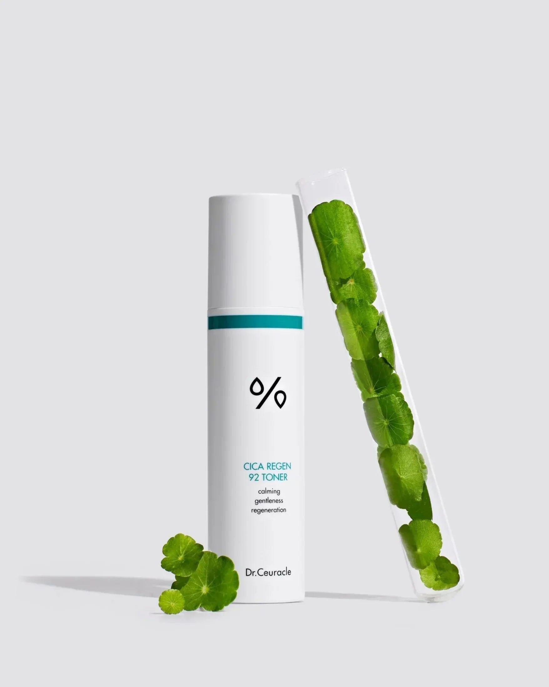 Dr. Ceuracle Cica Regen 92 Toner bottle with green centella leaves in test tube on white background