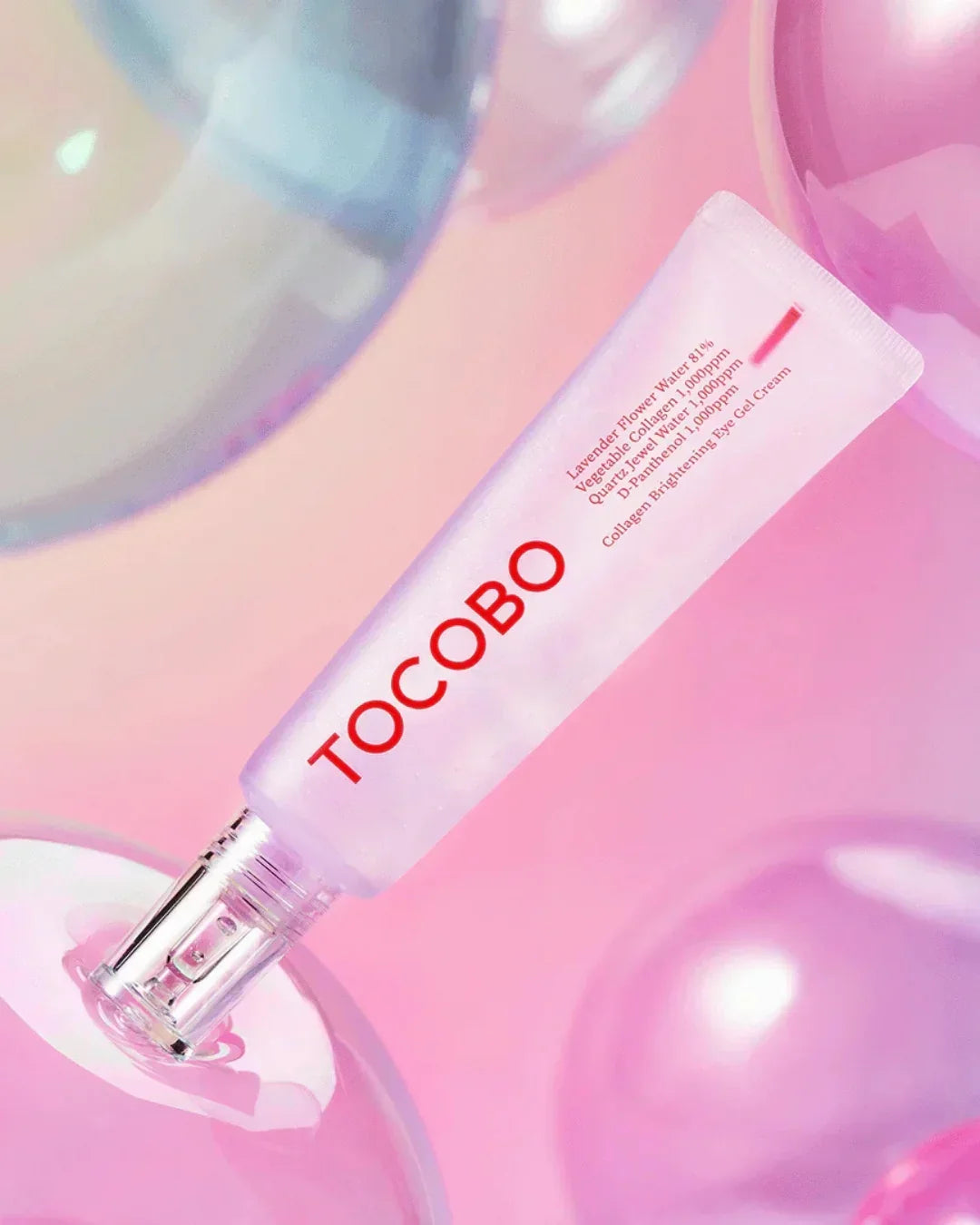 TOCOBO Collagen Brightening Eye Gel Cream tube on pink background with clear spherical props