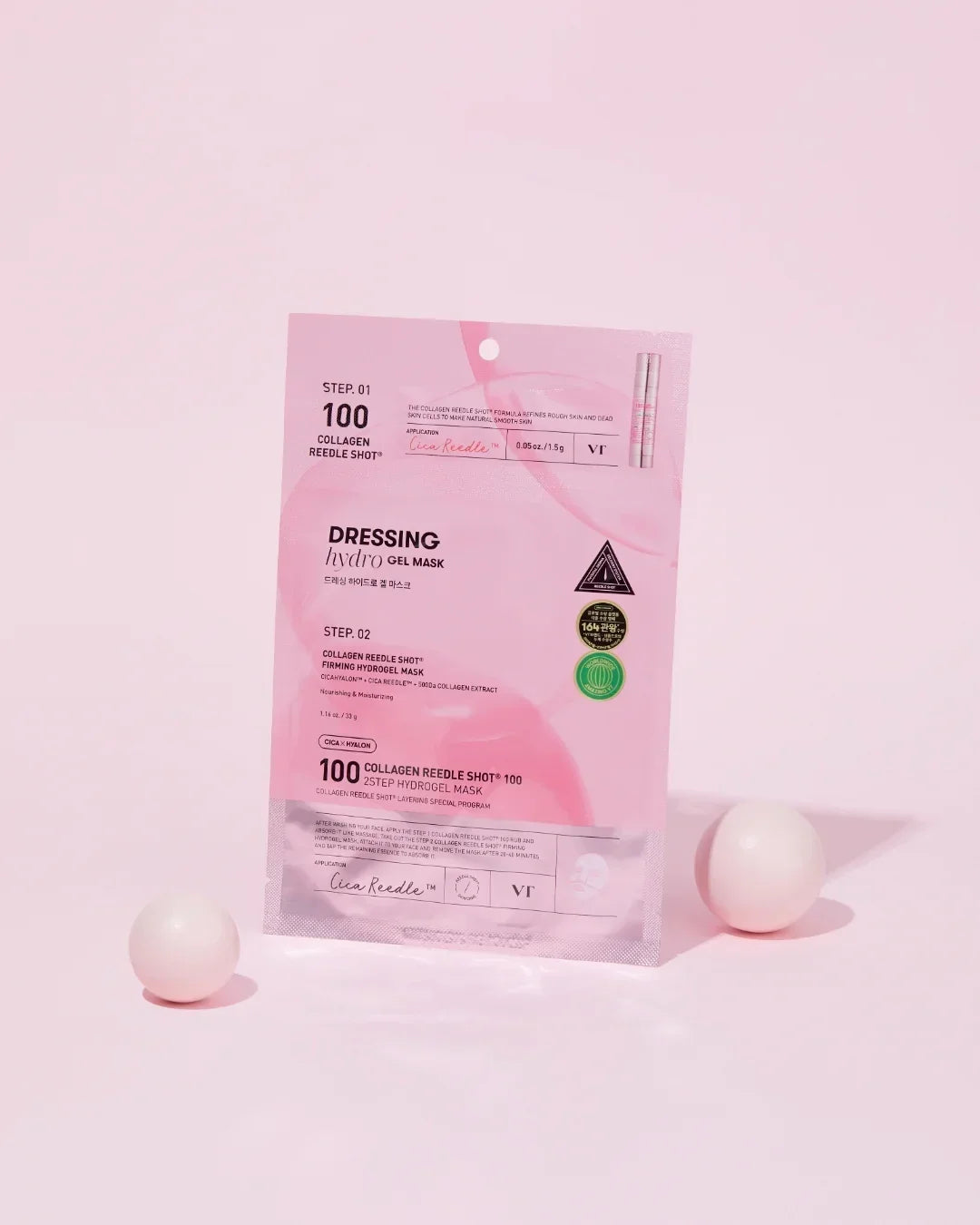 Pink collagen reedle shot hydrogel mask packaging with two white spheres on pink background