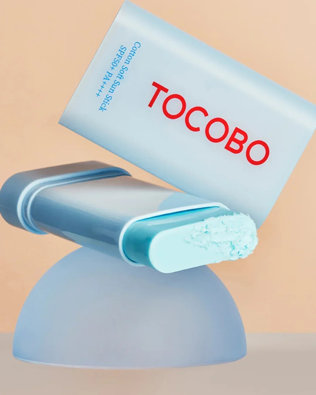 TOCOBO Cotton Soft Sun Stick SPF50 PA++++ with light blue soft textured sunscreen on beige background