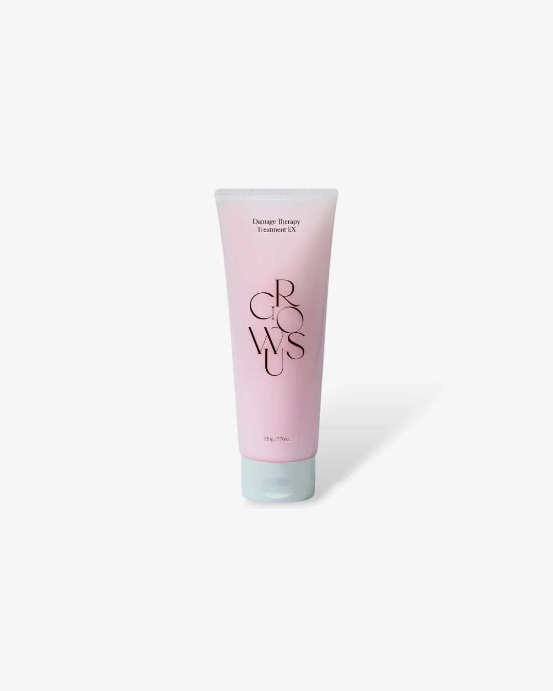 Pink tube of Growsus Damage Therapy Treatment EX hair care product on white background