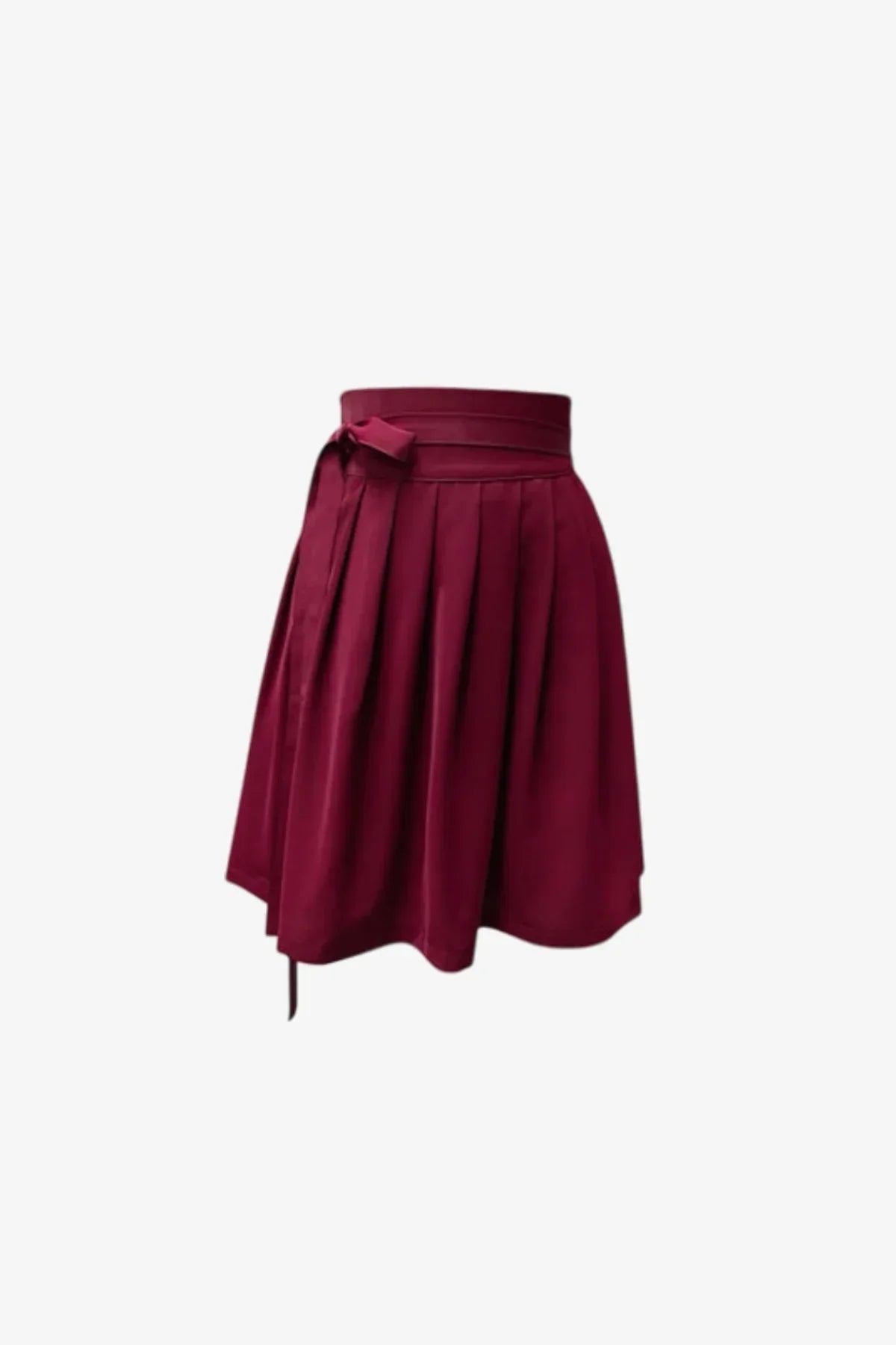 Wine-colored pleated mini skirt with wide waistband and side bow detail on white background