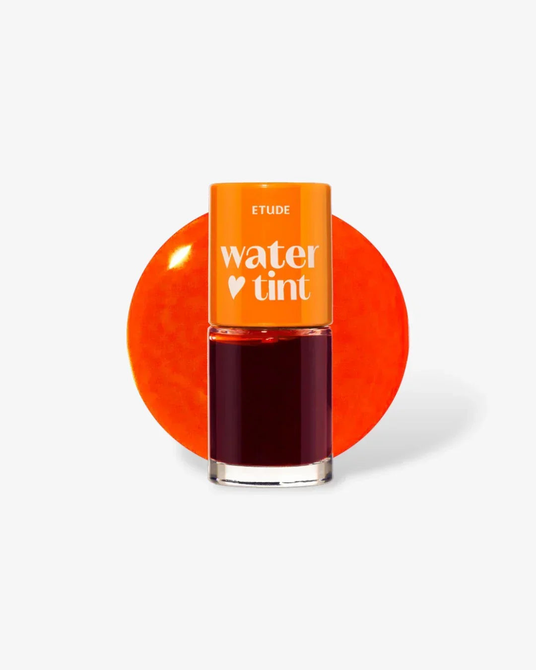 Etude Water Tint lip tint bottle with orange cap and dark red liquid, orange background