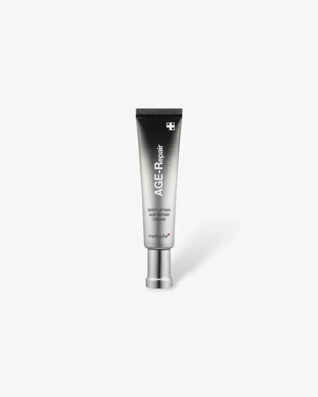 Silver tube of Medicube AGE-Repair deep lifting age repair cream on white background
